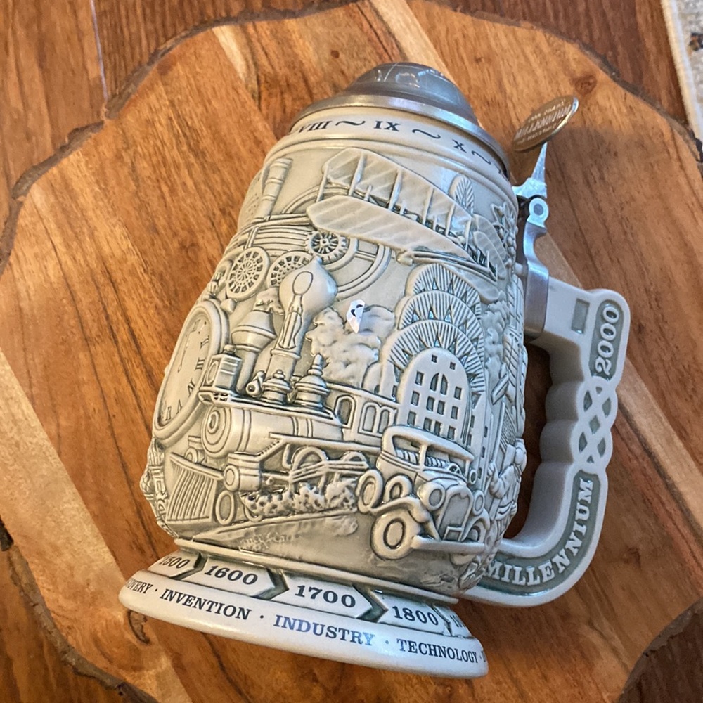 Vintage MILLENNIUM embossed stein mug